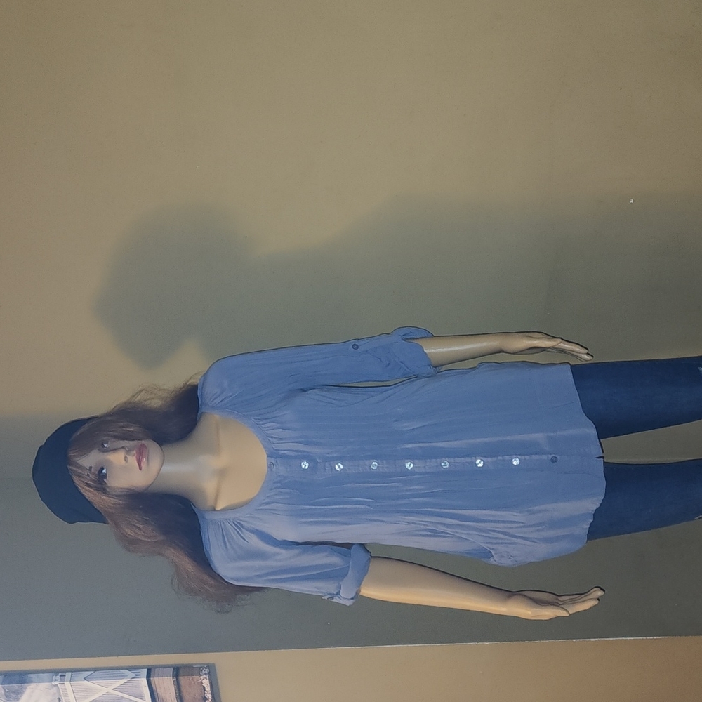 Small, gray, button-down blouse, with deep pockets